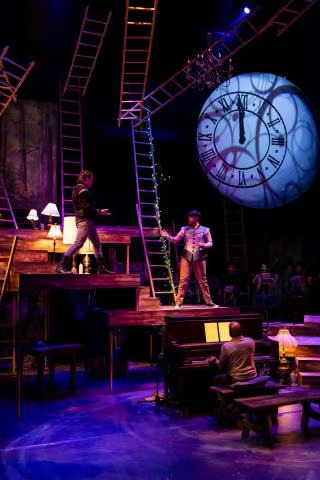 two actors performing on the Into the Woods stage
