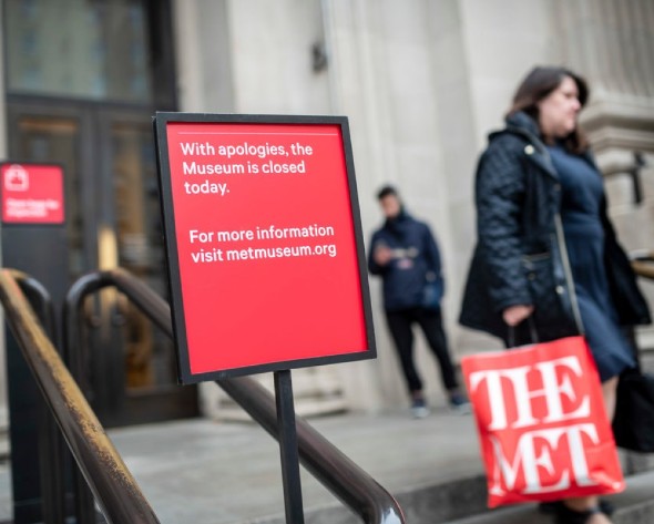 Signs on the steps of The Met announcing the museum’s closure.