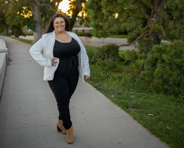 Photo of Andrea Macias walking in a park