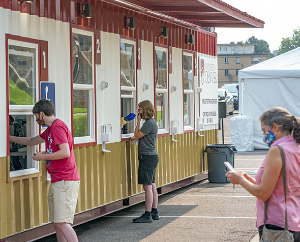 Students and faculty wait in line at a carepod COVID testing center on DU's campus in the summer of 2020