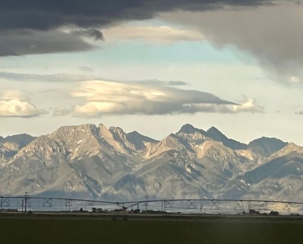 agricultural equipment and mountain range at San Luis Valley