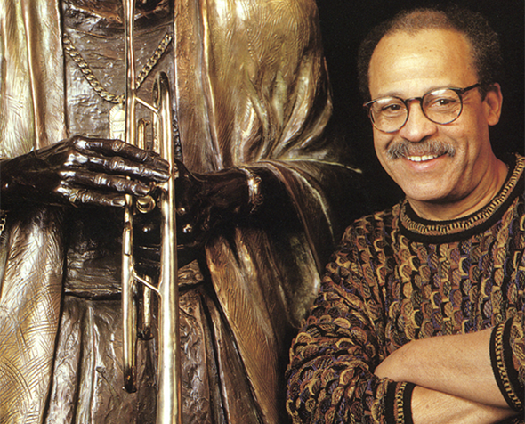 Ed Dwight next to his work
