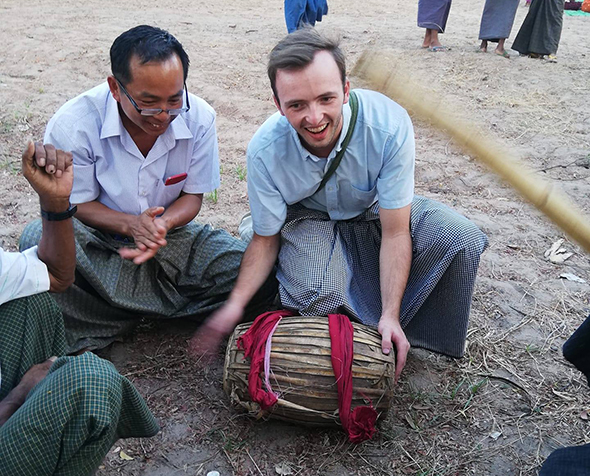 Kip Hagberg holds a drum during his time with the Peace Corps