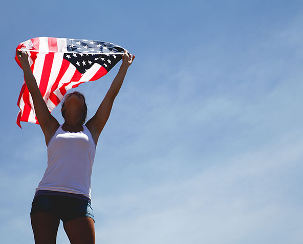 Photo of woman holding an American flag