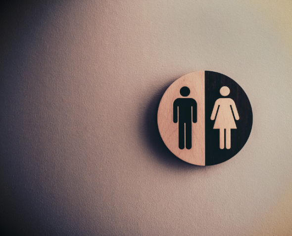 Black-and-white photo of gender signs