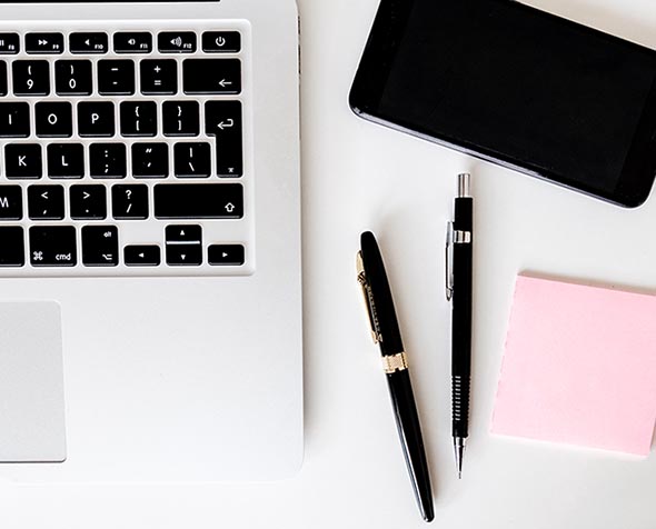 computer, pens, paper and phone