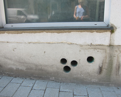 A photo of studio instructorJudith Leinen’s reflection in a window.