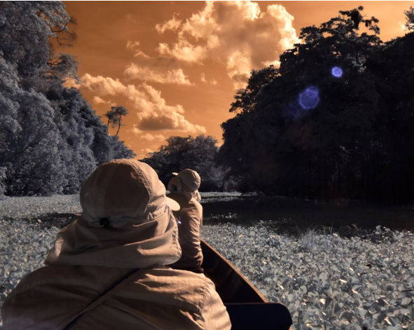 DU professor paddling on the Amazon river