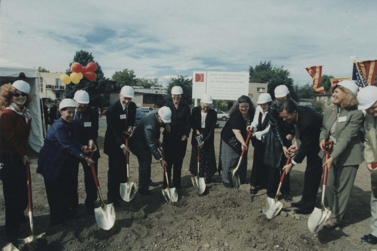 DU administrators dig into the dirt to mark the groundbreaking for the new Newman Center for the Performing Arts in the year 2000.