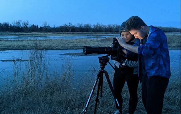 Students set up a camera to capture the Sandhill Crane Migration