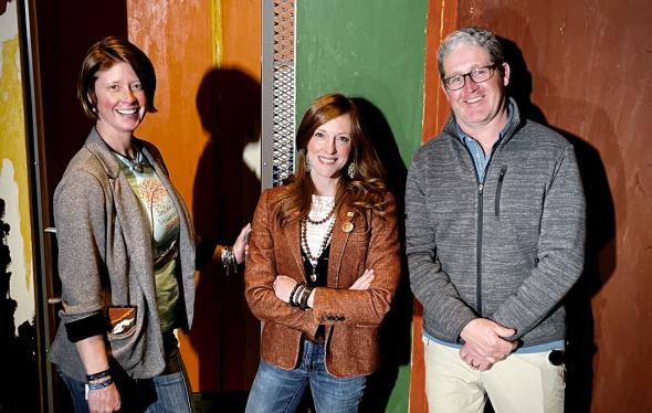 Celina Grey Taylor stands between two staff members at the Clyfford Still Museum
