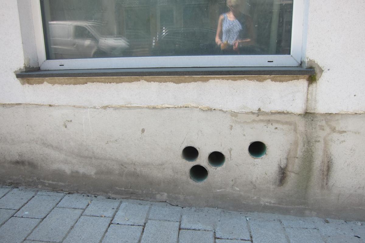 A photo of studio instructorJudith Leinen’s reflection in a window.
