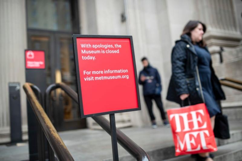 Signs on the steps of The Met announcing the museum’s closure.