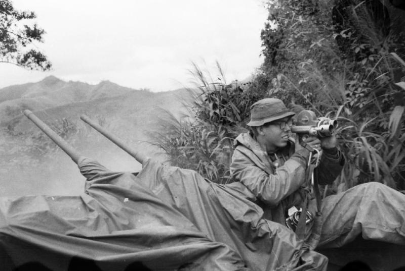 Photo of Tom Wolzien beside a gun truck in Vietnam