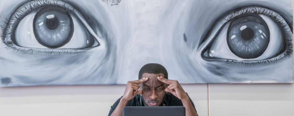 student studying in front of artwork