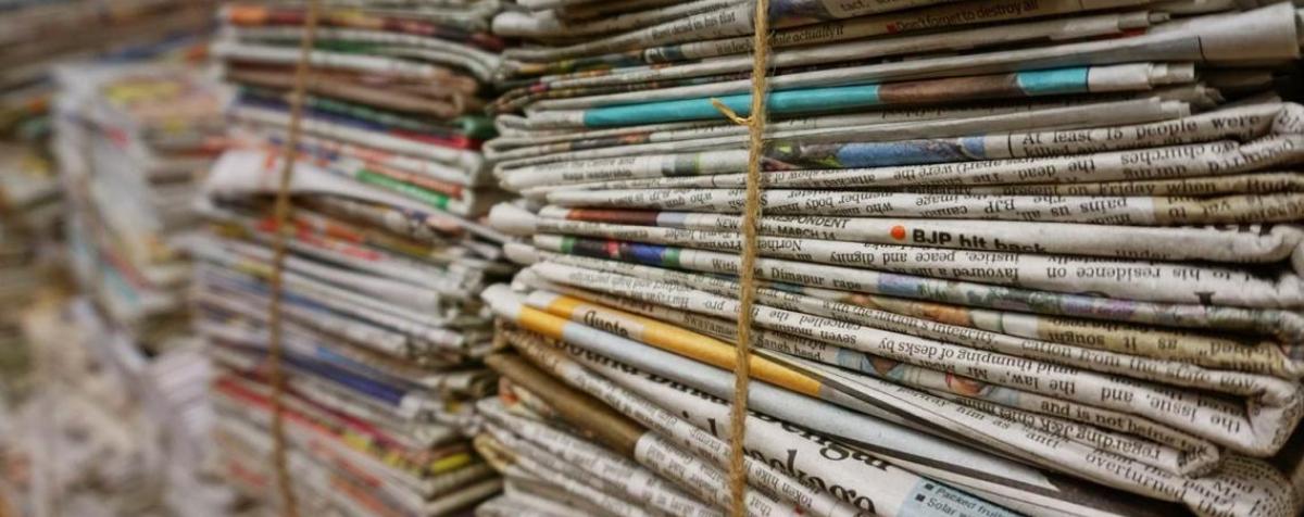 stacked newspapers