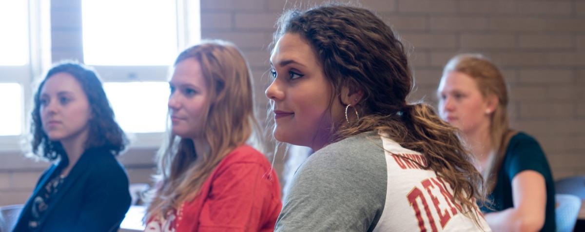 students listening in a classroom