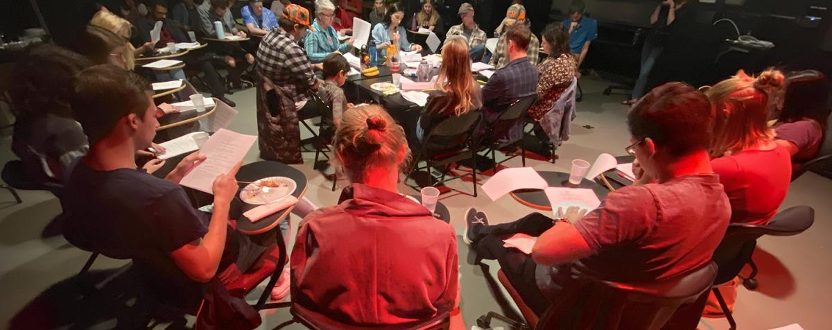 Students and community members participate in the cast and crew table read.