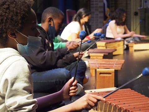Students playing xylophones