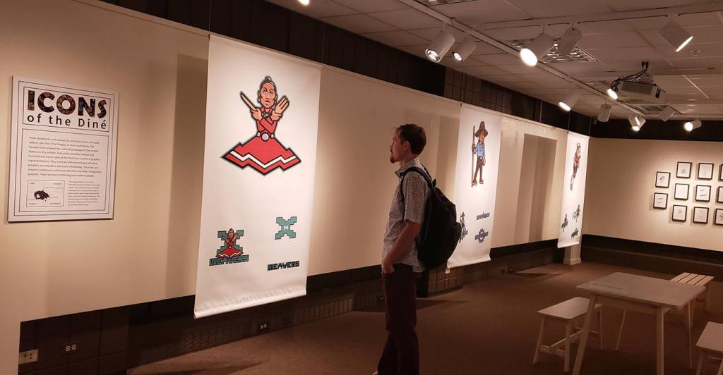A visitor admires a past exhibit at the Museum of Anthropology.