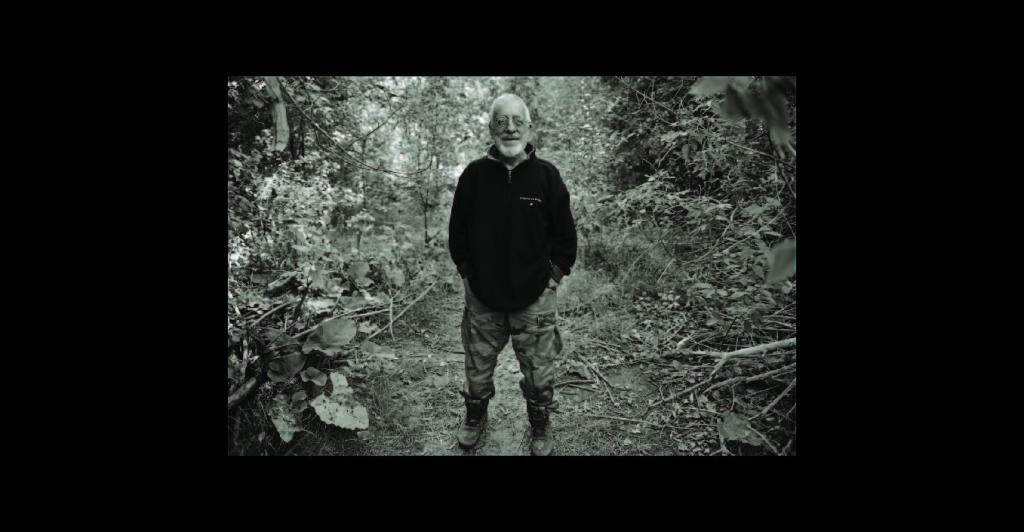 Man in front of camp