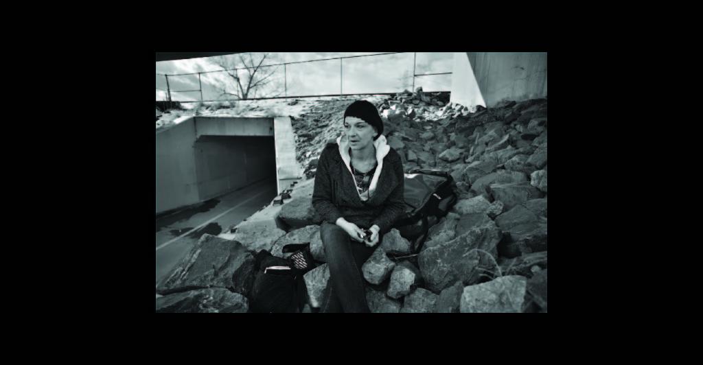 Woman sitting on rocks