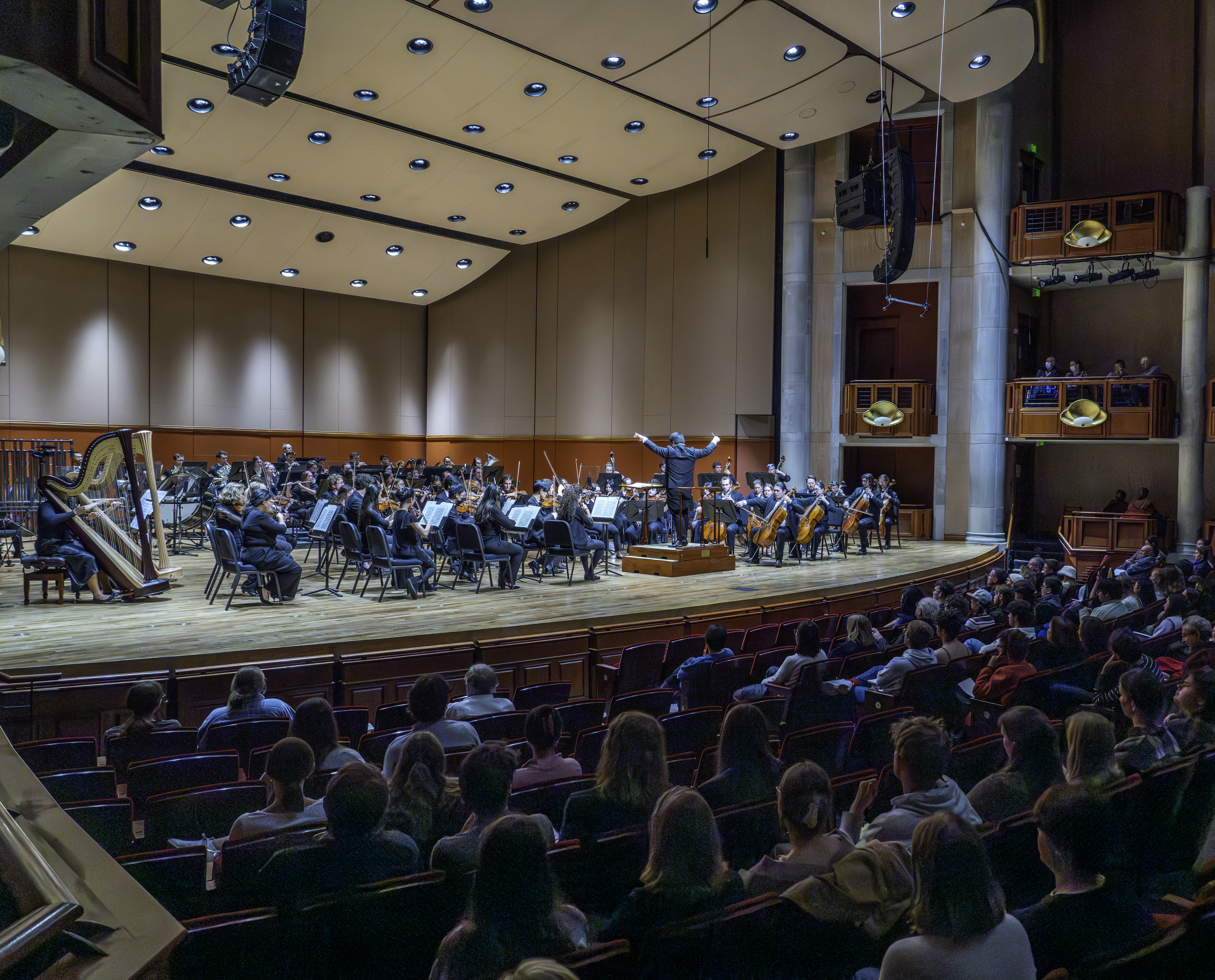 Audience and stage of a Lamont winter concert in Gates Hall.